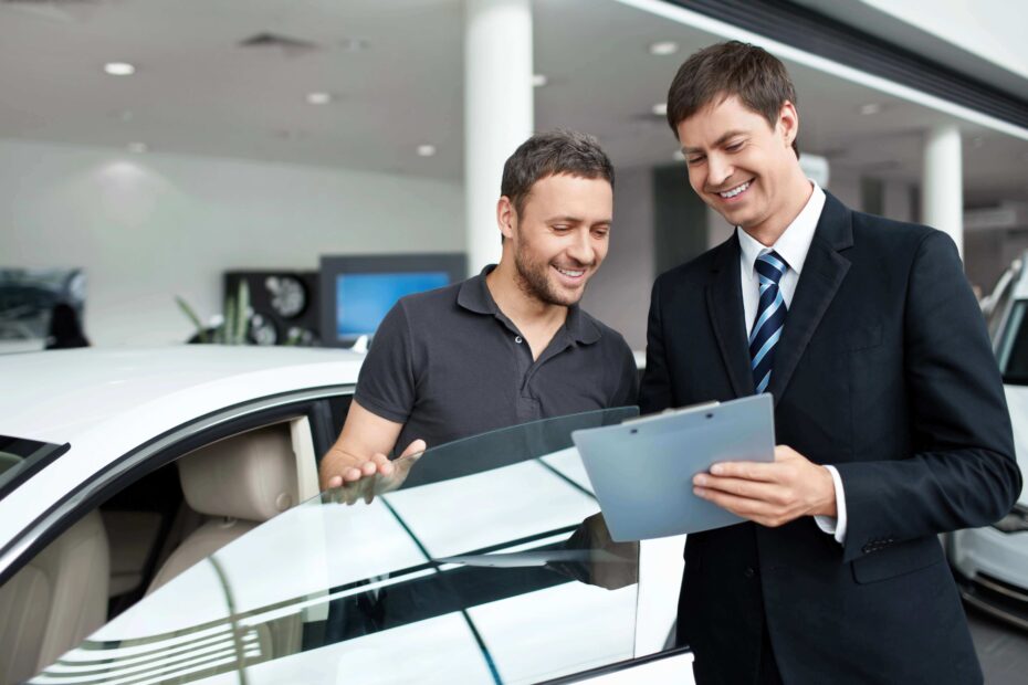 a man asking a auto dealer questions