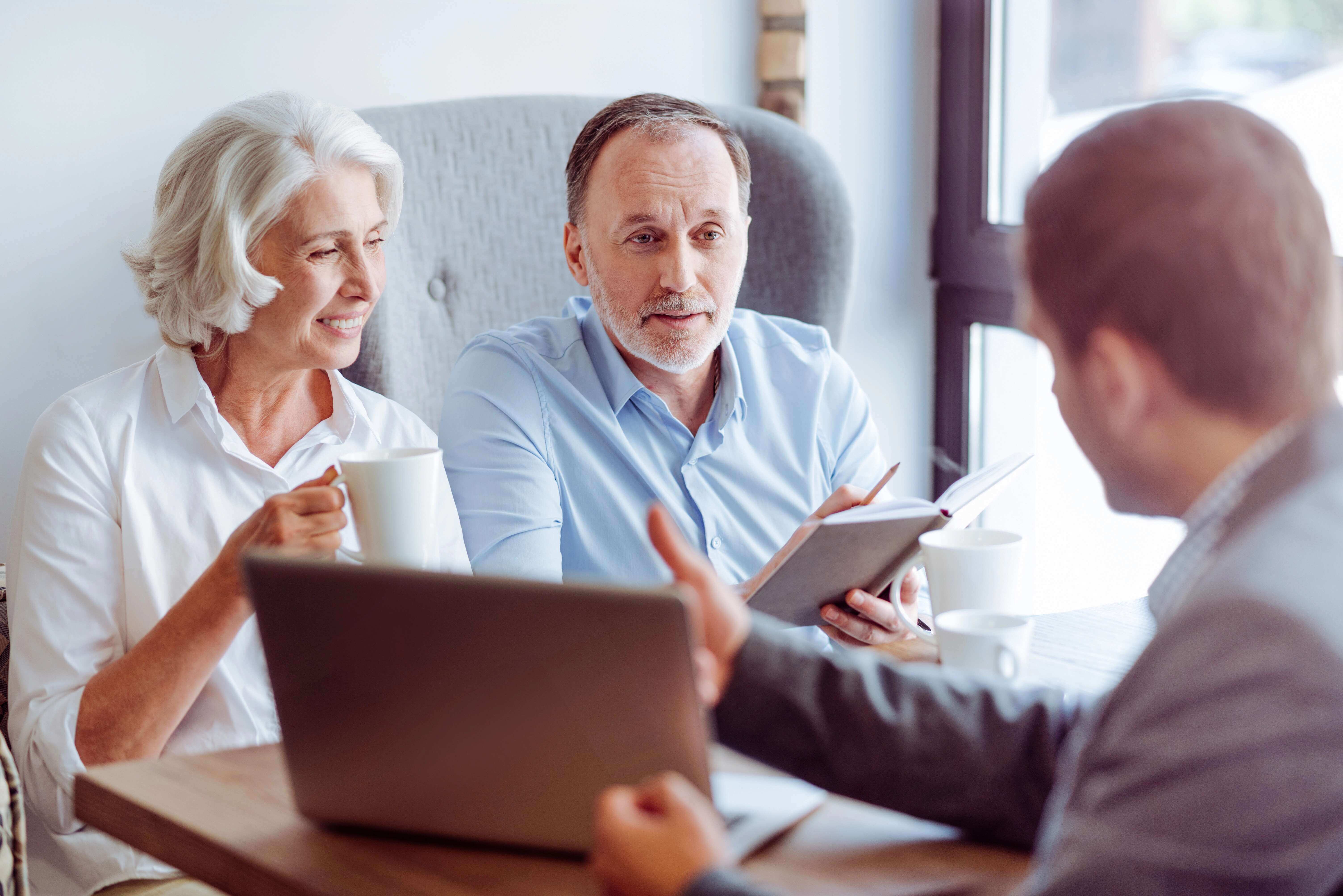 elderly couple discussing health insurance