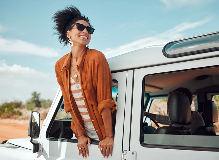 women-having-fun-on-a-car-trip